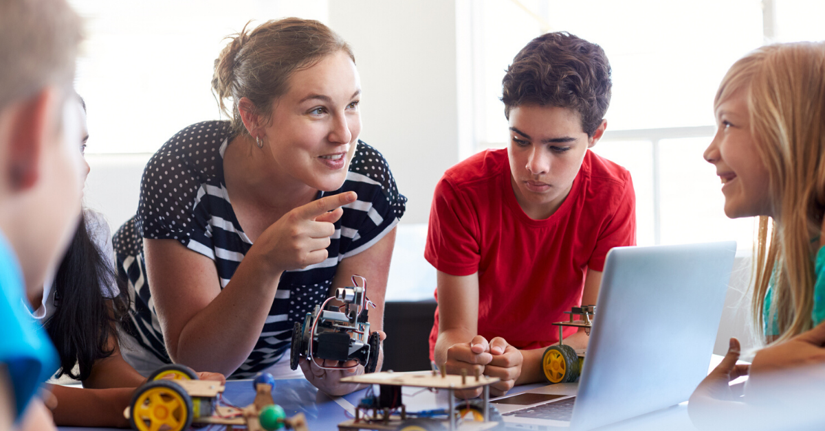 Image of students and teacher using technology