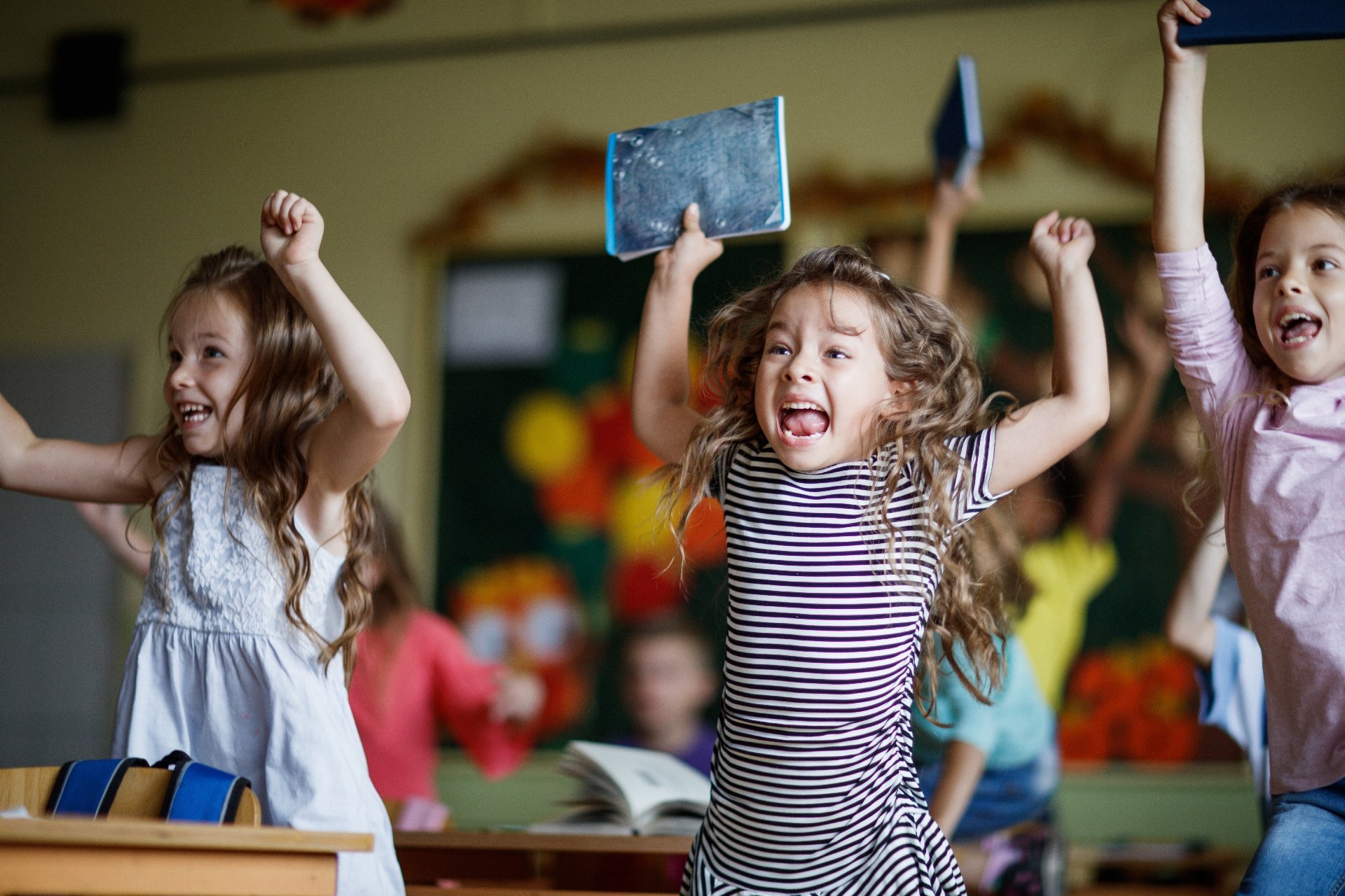 Kids jumping in a classroom